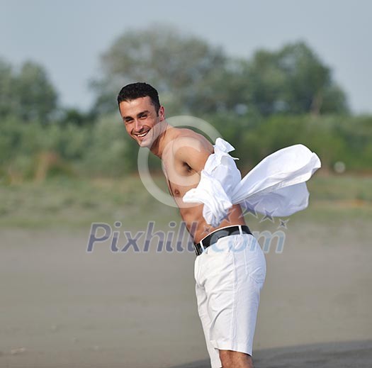 young man relax and have fun on beach at summer time young man relax and have fun on beach at summer time