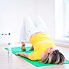 Pretty young woman doing YOGA exercise at home