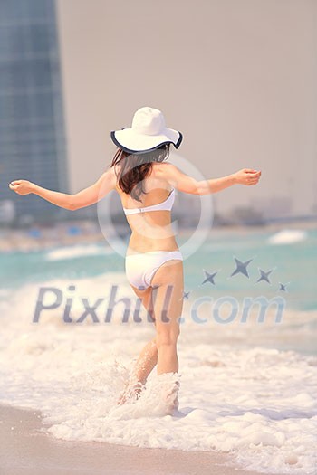 beautifel and happy woman girl on beach have fun and relax on summer vacation over the beautiful tropical sea beautifel and happy woman girl on beach have fun and relax on summer vacation over the beautiful tropical sea