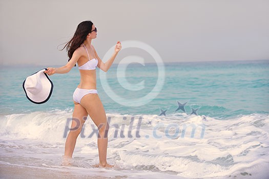beautifel and happy woman girl on beach have fun and relax on summer vacation over the beautiful tropical sea beautifel and happy woman girl on beach have fun and relax on summer vacation over the beautiful tropical sea