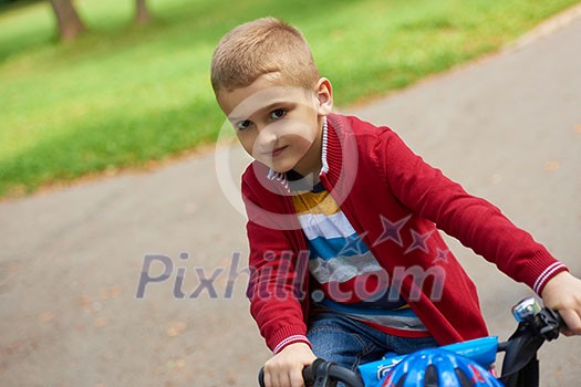 Young boy on the bicycle at Park Young boy on the bicycle at Park