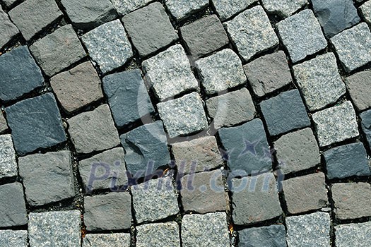 Floor of a street with stone tiles Floor of a street with stone tiles