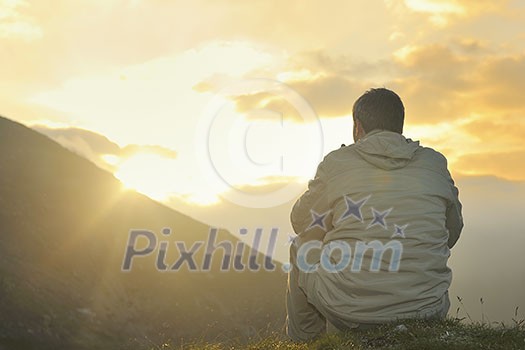 healthy young man practice yoga in height mountain at early morning and sunrise