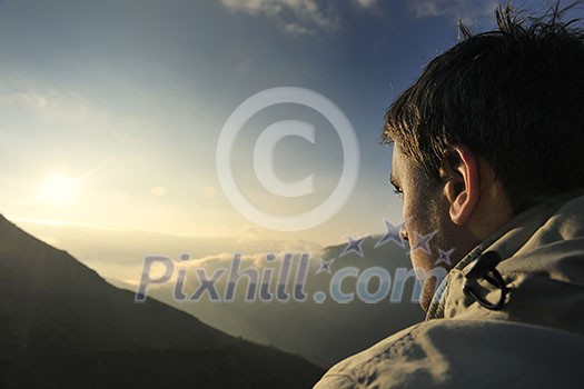 healthy young man practice yoga in height mountain at early morning and sunrise