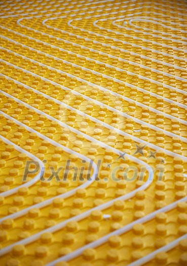 yellow underfloor heating posed in a under construction building yellow underfloor heating posed in a under construction building