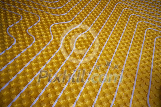 yellow underfloor heating posed in a under construction building yellow underfloor heating posed in a under construction building