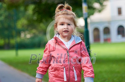 happy  little girl have fun in park