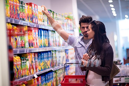 Young couple shopping in a supermarket Young couple shopping in a supermarket