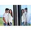 romantic happy young couple relax at modern home staircase indoors
