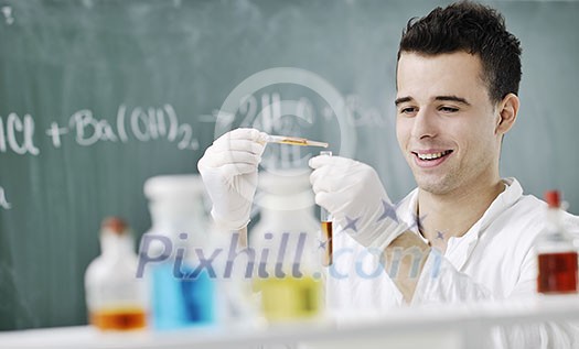 young man scientist in chemistry bright lab