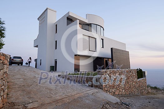 External view of a contemporary house modern villa at sunset External view of a contemporary house modern villa at sunset