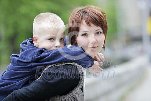 happy young mother and son have fun outdoor 