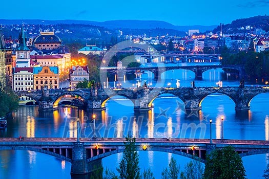 Travel Prague concept background - elevated view of bridges over Vltava river from Letna Park. Prague, Czech Republic in twilight