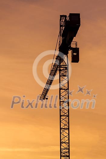 Building crane silhouette in sky on sunset. Munich, Germany Building crane silhouette in sky on sunset. Munich, Germany
