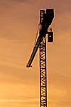 Building crane silhouette in sky on sunset. Munich, Germany