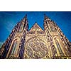 Vintage retro hipster style travel image of gothic architecture facade of St. Vitus Catherdal, Prague, Czech Republic with grunge texture overlaid