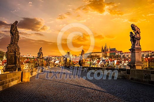 Charles bridge with statues and Prague castle on surise. Prague, Czech Republic