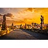 Charles bridge with statues and Prague castle on surise. Prague, Czech Republic