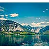Vintage retro effect filtered hipster style travel image of castle at Hallstatter See mountain lake in Austria. Salzkammergut region, Austria