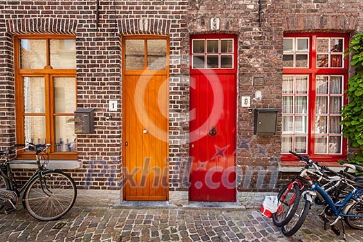 Doors of old houses and bicycles in european city. Bruges (Brugge), Belgium