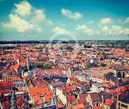 Vintage retro hipster style travel image of aerial view of Bruges (Brugge) from Belfry, Belgium with tilt shift toy effect shallow depth of field