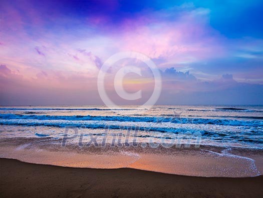 Peaceful ocean sunrise on beach