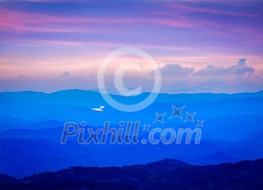 Peaceful sunset landscape in mountains in Munnar, Kerala, India Peaceful sunset landscape in mountains in Munnar, Kerala, India
