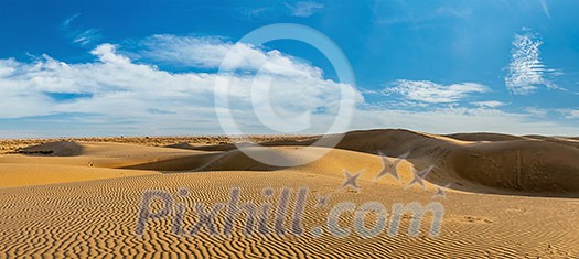 Panorama of dunes landscape with dramatic clouds in Thar Desert. Sam Sand dunes, Rajasthan, India