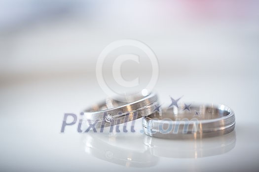 Two splendid wedding rings on a wedding day. Love concept.