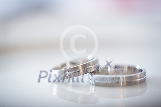 Two splendid wedding rings on a wedding day. Love concept. Two splendid wedding rings on a wedding day. Love concept.