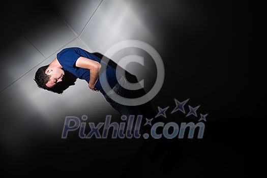 Young man suffering from severe belly pain, being cornered by the debilitating condition of celiak disease/Crohn's disease Young man suffering from severe belly pain, being cornered by the debilitating condition of celiak disease/Crohn's disease