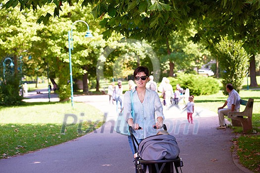 happy mother and baby child in park making first steps . Walking and hugging. happy mother and baby child in park making first steps . Walking and hugging.