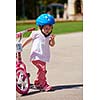 Happy childrens outdoor,  brother and sister in park have fun. Boy and girl in park learning to ride a bike.