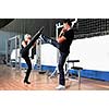 woman in the fitness gim working out with personal trainer coach