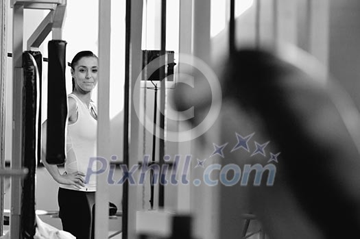 young woman practicing fitness and working out in a gym young woman practicing fitness and working out in a gym