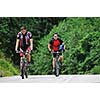 two friends have fun outdoor in nature and ride  on muntain bike