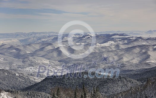 winter mountain landscape at sunny day and snow peaks