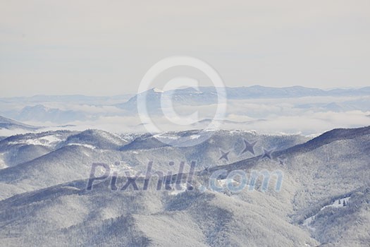 winter mountain landscape at sunny day and snow peaks