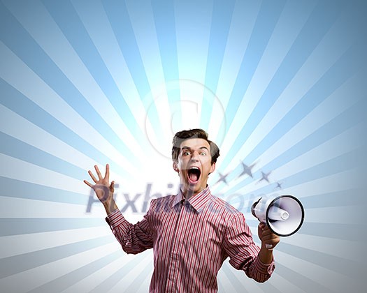 Young man in casual screaming in megaphone Young man in casual screaming in megaphone