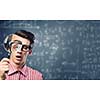 Young man scientist looking in magnifying glass