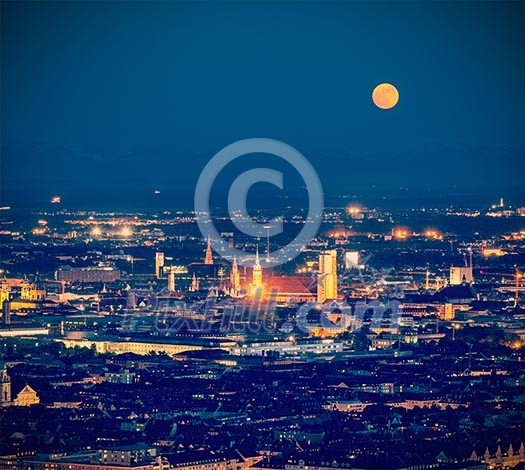Vintage retro hipster style travel image of night aerial view of Munich from Olympiaturm (Olympic Tower). Munich, Bavaria, Germany