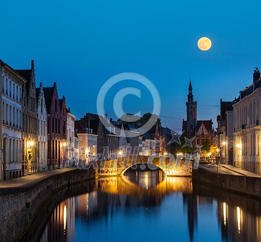 European medieval night city view background - Bruges (Brugge) canal in the evening, Belgium