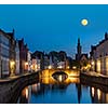 European medieval night city view background - Bruges (Brugge) canal in the evening, Belgium