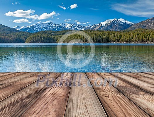 Wooden planks background with lake in Alps, Bavaria, Germany Wooden planks background with lake in Alps, Bavaria, Germany
