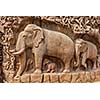 Elephants on descent of the Ganges and Arjuna's Penance ancient stone sculpture - monument at Mahabalipuram, Tamil Nadu, India