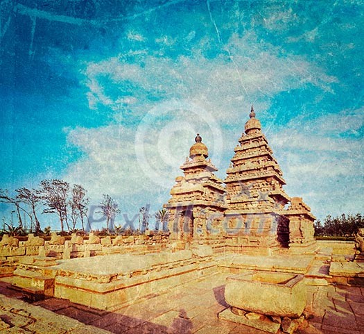 Vintage retro hipster style travel image of famous Tamil Nadu landmark - Shore temple, world  heritage site in  Mahabalipuram, Tamil Nadu, India with grunge texture overlaid