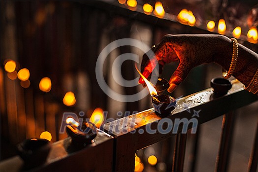 Lighting up Diwali lights. India