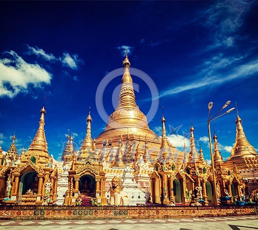 Vintage retro effect filtered hipster style image of Myanmer famous sacred place and tourist attraction landmark - Shwedagon Paya pagoda. Yangon, Myanmar Vintage retro effect filtered hipster style image of Myanmer famous sacred place and tourist attraction landmark - Shwedagon Paya pagoda. Yangon, Myanmar