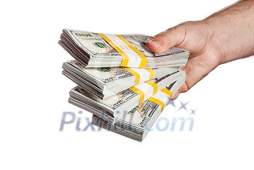 Creative business finance making money concept - hand holding stack of bundles of 100 US dollars 2013 edition banknotes bills isolated on white
