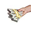 Creative business finance making money concept - hand holding stack of bundles of 100 US dollars 2013 edition banknotes bills isolated on white